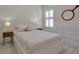 Cozy bedroom with white walls, shuttered window, wood floors and whimsical decor at 3712 76Th E St, Palmetto, FL 34221
