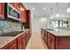 Gourmet kitchen with granite countertops, mosaic backsplash, and stainless steel appliances at 3712 76Th E St, Palmetto, FL 34221