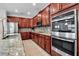Gourmet kitchen features stainless steel appliances, granite countertops, tiled backsplash, and tile flooring at 3712 76Th E St, Palmetto, FL 34221