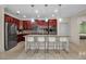 Beautiful kitchen includes stainless steel appliances, large island with seating, and pendant lights at 3712 76Th E St, Palmetto, FL 34221