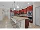 Modern kitchen featuring a center island with seating and stainless steel appliances at 3712 76Th E St, Palmetto, FL 34221