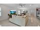 Open-concept living room with tile floors, modern fan, and ample natural light at 3712 76Th E St, Palmetto, FL 34221