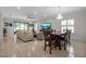 Open-concept living and dining area with lots of natural light and comfortable seating at 3712 76Th E St, Palmetto, FL 34221