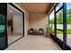 Screened-in lanai featuring tiled floor, neutral walls, and comfortable seating area at 3712 76Th E St, Palmetto, FL 34221