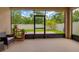 Covered patio with view of landscaped backyard through screen enclosure at 3712 76Th E St, Palmetto, FL 34221