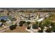 Panoramic aerial shot showcasing the community, water features, golf course, and surrounding landscapes at 386 Club Manor Dr, Sun City Center, FL 33573