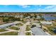 Aerial view of the property highlighting its location within the community and proximity to water features at 386 Club Manor Dr, Sun City Center, FL 33573