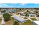Wide aerial view showcasing the home's location within the community and its proximity to ponds at 386 Club Manor Dr, Sun City Center, FL 33573