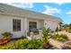 Home with a brick walkway and a cozy porch area with bench seating at 386 Club Manor Dr, Sun City Center, FL 33573
