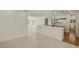 Bright kitchen with white cabinets, appliances, and a spacious center island at 386 Club Manor Dr, Sun City Center, FL 33573