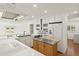 Kitchen with white cabinets, stainless steel appliances, and a butcher block island at 386 Club Manor Dr, Sun City Center, FL 33573