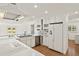 Kitchen featuring white cabinetry, stainless appliances and a view of the backyard at 386 Club Manor Dr, Sun City Center, FL 33573
