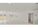 Bright and airy living room featuring French doors and recessed lighting at 386 Club Manor Dr, Sun City Center, FL 33573
