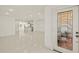 Spacious open floorplan showcasing tile floors with a view to the kitchen at 386 Club Manor Dr, Sun City Center, FL 33573