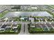 Beautiful aerial view of the community with a lake, pool, clubhouse, and well-maintained landscaping at 4005 Willow Branch Pl, Palmetto, FL 34221
