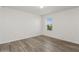 Clean bedroom with modern vinyl flooring and a view of the front yard at 4005 Willow Branch Pl, Palmetto, FL 34221