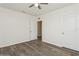 Bedroom with wood-look flooring and open bathroom access is a blank canvas ready to be personalized at 4005 Willow Branch Pl, Palmetto, FL 34221