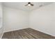 Bedroom with wood-look flooring and ceiling fan offers a neutral color palette for versatile decor at 4005 Willow Branch Pl, Palmetto, FL 34221