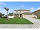 Inviting two-story home boasting a well-manicured lawn and attached two-car garage at 4005 Willow Branch Pl, Palmetto, FL 34221