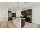 Open kitchen featuring dark cabinetry, granite countertops, and stainless steel appliances at 4005 Willow Branch Pl, Palmetto, FL 34221