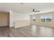 Upstairs loft area featuring modern vinyl flooring and neutral tones at 4005 Willow Branch Pl, Palmetto, FL 34221