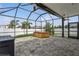 Spacious covered lanai with brick pavers, ceiling fans, and a hot tub at 4005 Willow Branch Pl, Palmetto, FL 34221
