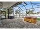 Covered lanai with brick pavers, ceiling fans, hot tub, and exterior storage chest at 4005 Willow Branch Pl, Palmetto, FL 34221