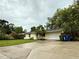 Well-kept house features a front yard, a convenient driveway, and a one car garage at 4110 Longhorn Dr, Sarasota, FL 34233