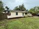 This home features lush landscaping, a vibrant green lawn, and a freshly mulched garden at 4110 Longhorn Dr, Sarasota, FL 34233