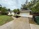 Well-maintained single-Gathering home features an attached garage, manicured landscaping, and a tidy front yard at 4110 Longhorn Dr, Sarasota, FL 34233