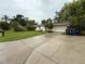 Charming single-story home with a well-maintained lawn and a long driveway at 4110 Longhorn Dr, Sarasota, FL 34233