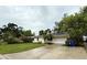 Well-kept house features a front yard, a convenient driveway, and a one car garage at 4110 Longhorn Dr, Sarasota, FL 34233