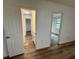 Hallway view showcasing the flooring and the architectural flow from one room to another at 4110 Longhorn Dr, Sarasota, FL 34233