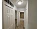 Hallway with multiple doors leading to bedrooms and bathroom at 4110 Longhorn Dr, Sarasota, FL 34233