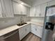 Bright kitchen with stainless steel appliances, white cabinets, and quartz countertops at 4110 Longhorn Dr, Sarasota, FL 34233