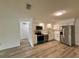 Updated kitchen with stainless steel appliances, white cabinets, and modern fixtures at 4110 Longhorn Dr, Sarasota, FL 34233