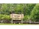 Entrance to Urfer Gathering Park featuring address on Honore Avenue amidst lush greenery and rustic wooden fence at 4110 Longhorn Dr, Sarasota, FL 34233