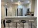 Modern kitchen features stainless steel appliances and a breakfast bar with seating at 4441 Groveland Ave, Sarasota, FL 34231
