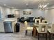 Spacious living room seamlessly connects to the dining and kitchen areas at 4441 Groveland Ave, Sarasota, FL 34231