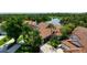 Beautiful aerial view of a luxury home near a lake and golf course at 4472 Calle Serena, Sarasota, FL 34238