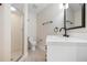 Bathroom with walk-in shower and vanity with modern fixtures and finishes at 4472 Calle Serena, Sarasota, FL 34238