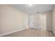 Bedroom with wood-look flooring, neutral paint, and ample closet space at 4472 Calle Serena, Sarasota, FL 34238