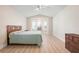 Bright bedroom featuring a window seat and light, wood-look flooring at 4472 Calle Serena, Sarasota, FL 34238