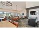 Spacious dining room with elegant lighting and views of the golf course at 4472 Calle Serena, Sarasota, FL 34238