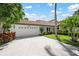 Charming single-story home with a well-maintained lawn, beautiful landscaping, and a two-car garage at 4472 Calle Serena, Sarasota, FL 34238
