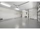 Spacious two-car garage with storage shelving at 4472 Calle Serena, Sarasota, FL 34238