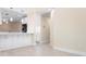 Open-concept kitchen featuring white cabinets and lots of countertop space overlooking adjacent room at 4472 Calle Serena, Sarasota, FL 34238