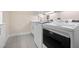 Modern laundry room with stylish appliances, countertops and tile flooring at 4472 Calle Serena, Sarasota, FL 34238