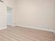 Open-concept living room features wood floors and neutral paint, creating a serene space at 4472 Calle Serena, Sarasota, FL 34238