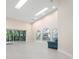 Bright and airy living room featuring high ceilings, tile floors, and large windows at 4472 Calle Serena, Sarasota, FL 34238
